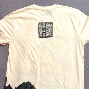 This is a cream and black shirt size medium with a amazing design